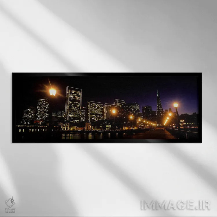 تابلو دکوراتیو ساختمان ها در کنار آب روشن شده در شب، سانفرانسیسکو، کال… اثر پانورامیک ایمجز - نمای قابدار مشکی