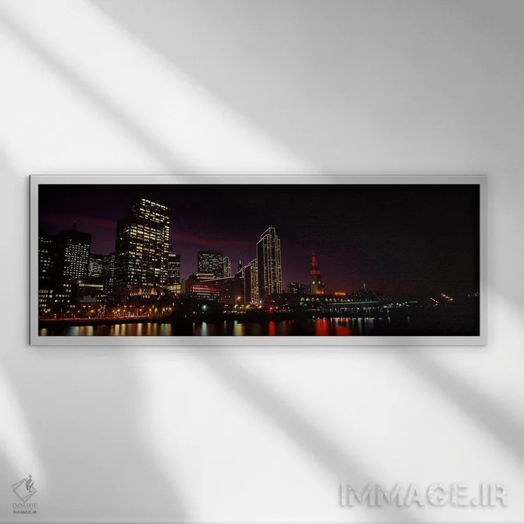 تابلو دکوراتیو ساختمان ها در کنار آب روشن شده در شب، سانفرانسیسکو، کال… اثر پانورامیک ایمجز - نمای قابدار سفید