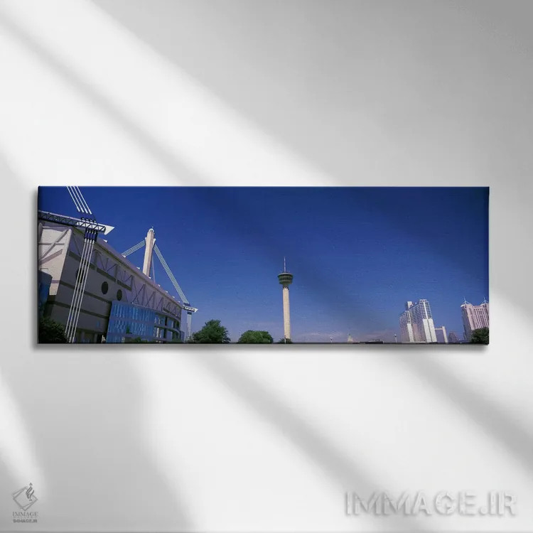 تابلو دکوراتیو ساختمان ها در یک شهر، آلامودوم، برج قاره ها، هتل ماریت… اثر پانورامیک ایمجز - نمای روبهرو روی دیوار