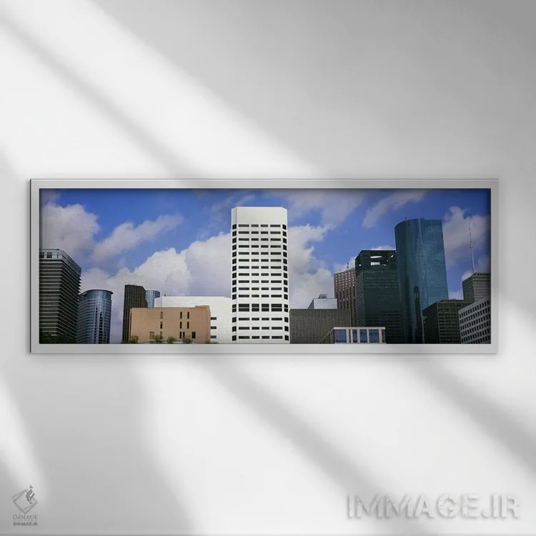 تابلو دکوراتیو نمای پایین از ساختمان ها در یک شهر، برج وج، ساختمان اکس… اثر پانورامیک ایمجز - نمای قابدار سفید