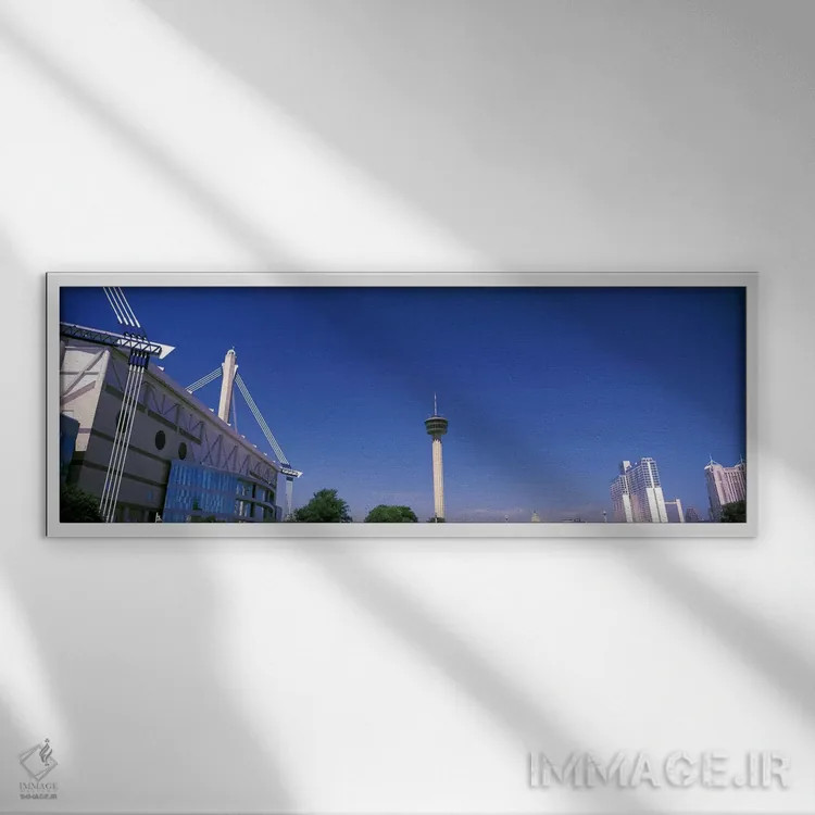 تابلو دکوراتیو ساختمان ها در یک شهر، آلامودوم، برج قاره ها، هتل ماریت… اثر پانورامیک ایمجز - نمای قابدار سفید