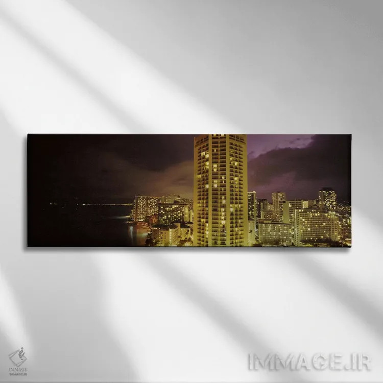 تابلو دکوراتیو ساختمان ها که در شب روشن شده اند، هونولولو، اوهاو، هاوا… اثر پانورامیک ایمجز - نمای روبهرو روی دیوار