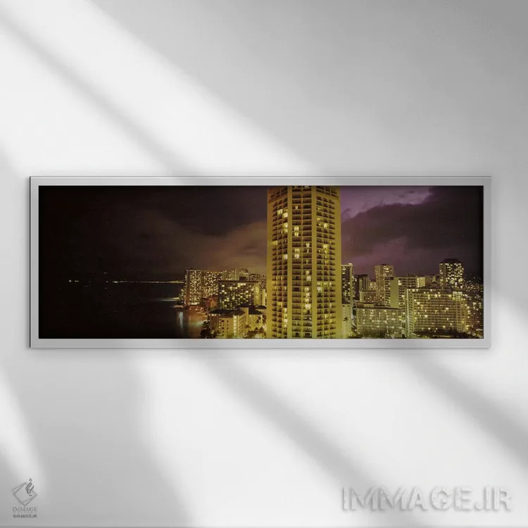 تابلو دکوراتیو ساختمان ها که در شب روشن شده اند، هونولولو، اوهاو، هاوا… اثر پانورامیک ایمجز - نمای قابدار سفید