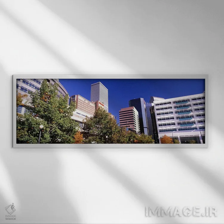 تابلو دکوراتیو نمای پایین از ساختمان ها در یک شهر، هتل شرایتون مرکز شه… اثر پانورامیک ایمجز - نمای قابدار سفید