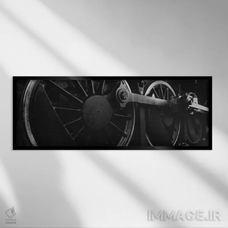 تابلو دکوراتیو چرخ های محرک لکوموتیو بخار در سیاه و سفید اثر پانورامیک ایمجز - نمای قابدار مشکی