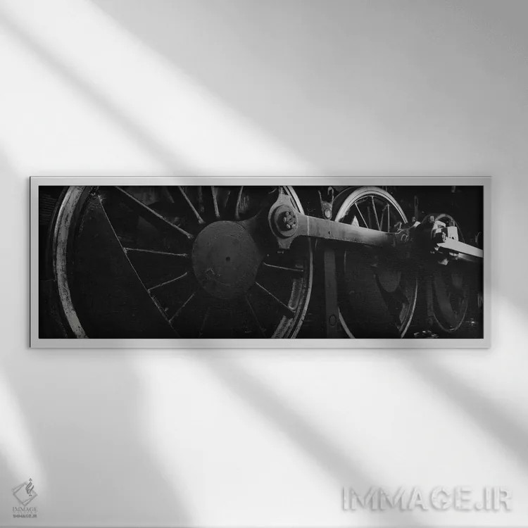 تابلو دکوراتیو چرخ های محرک لکوموتیو بخار در سیاه و سفید اثر پانورامیک ایمجز - نمای قابدار سفید