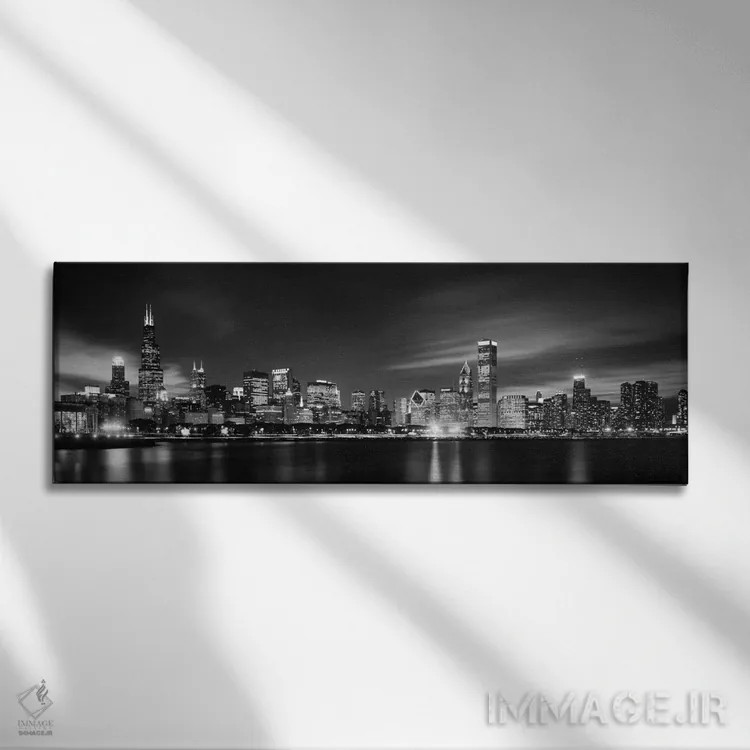 تابلو دکوراتیو نمای آسمان خراش های مرکز شهر در شب به صورت سیاه و سفید… اثر پانورامیک ایمجز - نمای روبهرو روی دیوار