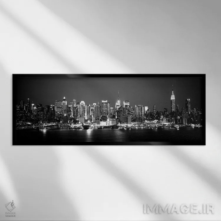 تابلو دکوراتیو "ساختمان ها در کنار آب، منهتن، نیویورک سیتی، ایالت نیوی… اثر پانورامیک ایمجز - نمای قابدار مشکی