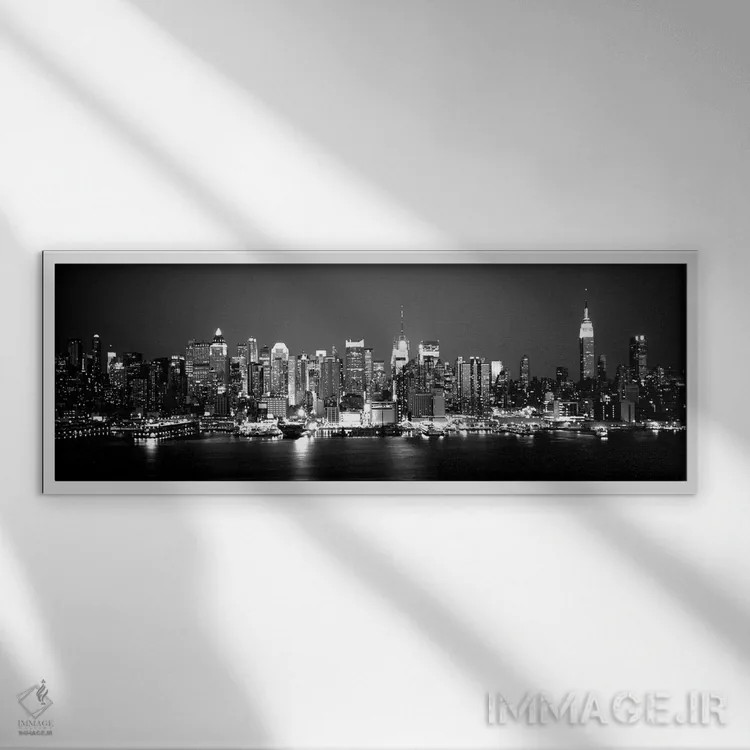 تابلو دکوراتیو "ساختمان ها در کنار آب، منهتن، نیویورک سیتی، ایالت نیوی… اثر پانورامیک ایمجز - نمای قابدار سفید
