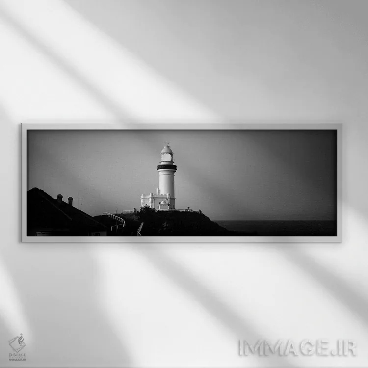 تابلو دکوراتیو "فانوس دریایی در شامگاه، فانوس دریایی بروین بی، نیو ساو… اثر پانورامیک ایمجز - نمای قابدار سفید