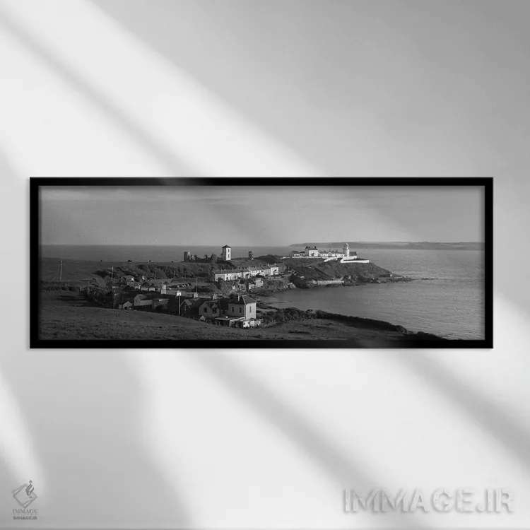 تابلو دکوراتیو "فانوس دریایی روی ساحل، فانوس دریایی روچ، شهرستان کرک… اثر پانورامیک ایمجز - نمای قابدار مشکی