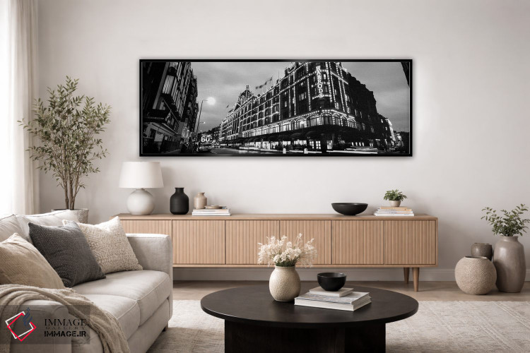 تابلو دکوراتیو "نمای زاویه پایین از ساختمان هایی که شب ها روشن است، ها… اثر پانورامیک ایمجز - D4B