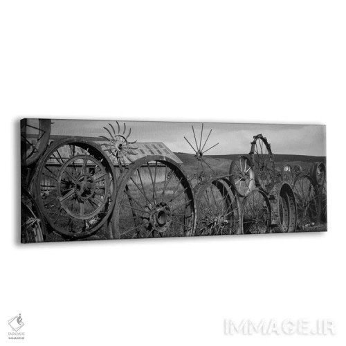 تابلو دکوراتیو "انبار قدیمی با حصاری از چرخ ها، پالووس، شهرستان ویتمن… اثر پانورامیک ایمجز - نمای پرسپکتیو محصول