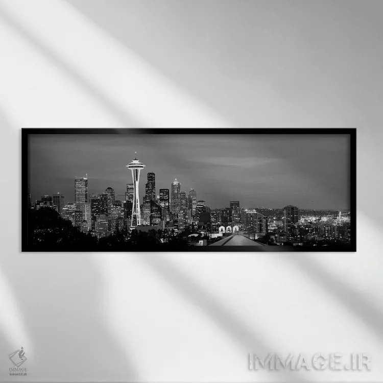 تابلو دکوراتیو "آسمان خراش ها در یک شهر که شب ها روشن است، اسپیس نیل… اثر پانورامیک ایمجز - نمای قابدار مشکی