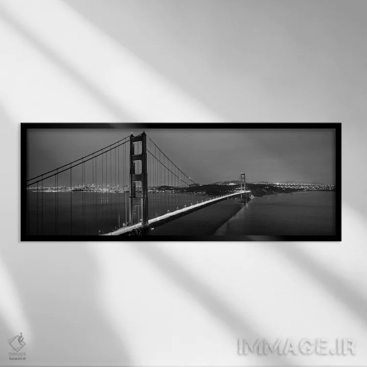 تابلو دکوراتیو "پل معلق روشن در شامگاه، پل دروازه طلایی، سانفرانسیسکو… اثر پانورامیک ایمجز - نمای قابدار مشکی