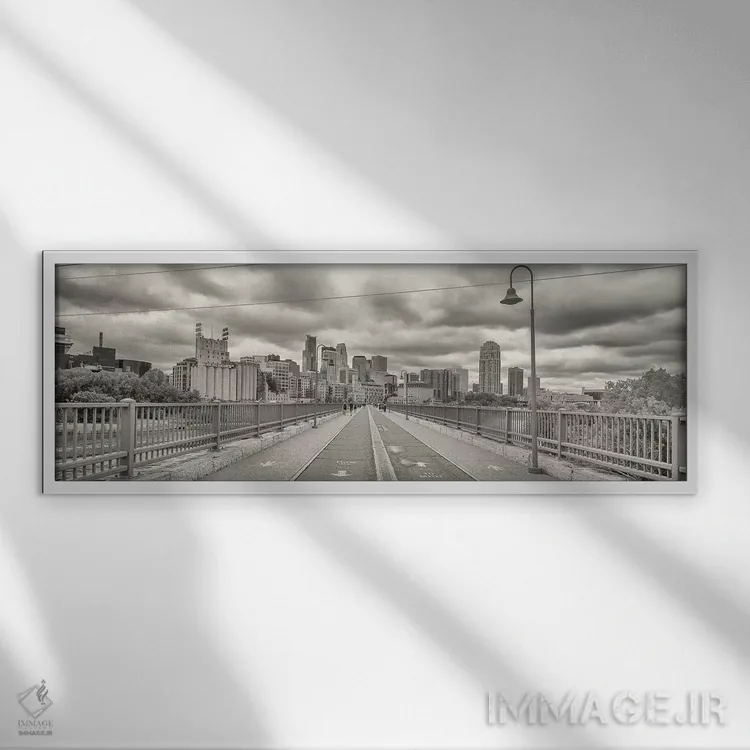 تابلو دکوراتیو "پل قوسی سنگی با ساختمان هایی در پس زمینه، منطقه میل، م… اثر پانورامیک ایمجز - نمای قابدار سفید