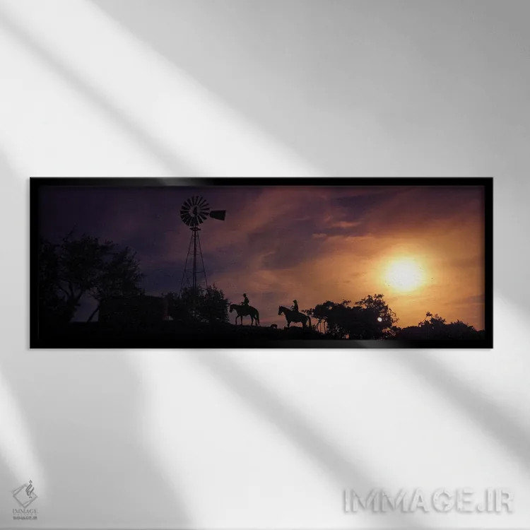 تابلو دکوراتیو سیلوئت دو موج سوار بر ساحل در غروب، پالووس وردی، کالیفر… اثر پانورامیک ایمجز - نمای قابدار مشکی