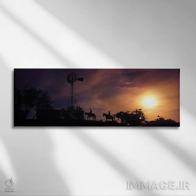 تابلو دکوراتیو سیلوئت دو موج سوار بر ساحل در غروب، پالووس وردی، کالیفر… اثر پانورامیک ایمجز - نمای روبهرو روی دیوار