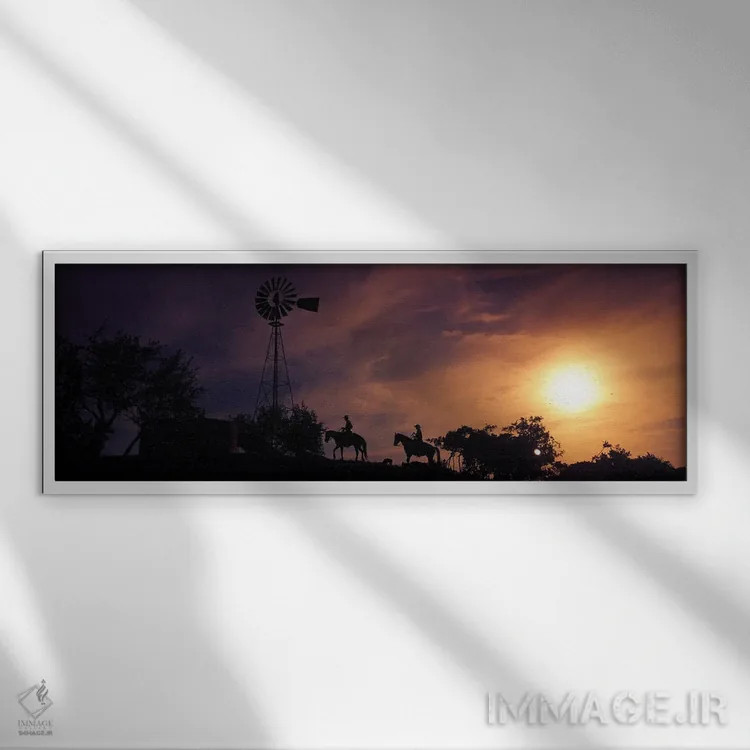 تابلو دکوراتیو سیلوئت دو موج سوار بر ساحل در غروب، پالووس وردی، کالیفر… اثر پانورامیک ایمجز - نمای قابدار سفید