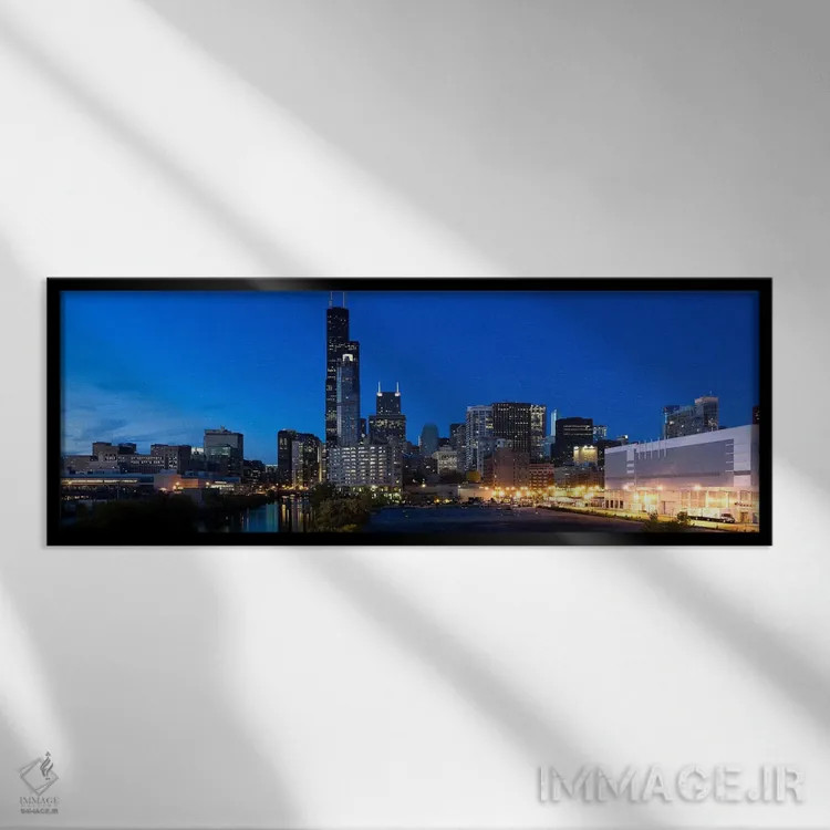تابلو دکوراتیو Chicago, Illinois, USA,ساختمان ها در شهر روشن هنگام غرو… اثر پانورامیک ایمجز - نمای قابدار مشکی
