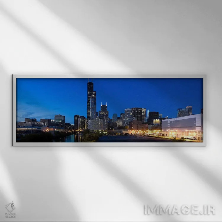 تابلو دکوراتیو Chicago, Illinois, USA,ساختمان ها در شهر روشن هنگام غرو… اثر پانورامیک ایمجز - نمای قابدار سفید