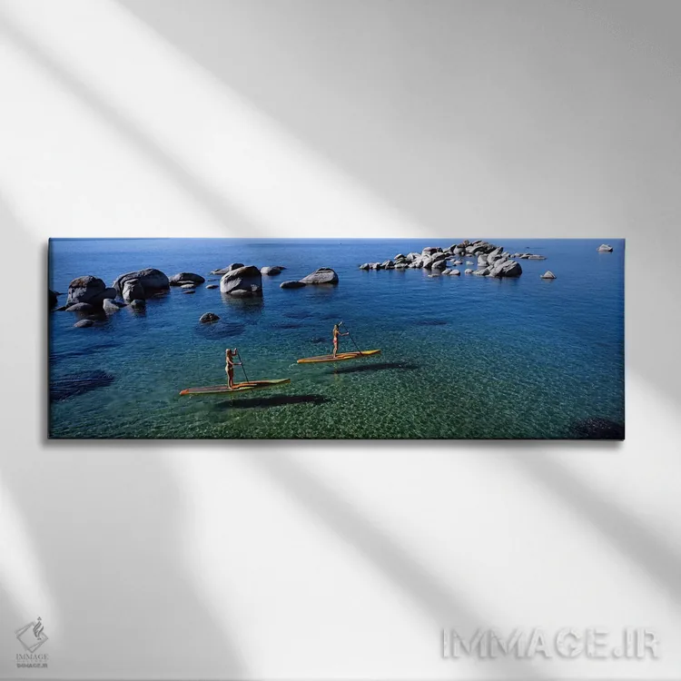 تابلو دکوراتیو Lake Tahoe, California, USA,دو زن در حال پارو زدن روی ب… اثر پانورامیک ایمجز - نمای روبهرو روی دیوار