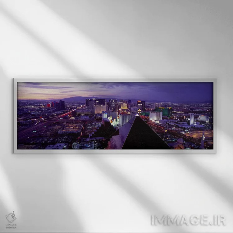 تابلو دکوراتیو Las Vegas, Clark County, Nevada, USA,شهر در حال روشنایی… اثر پانورامیک ایمجز - نمای قابدار سفید