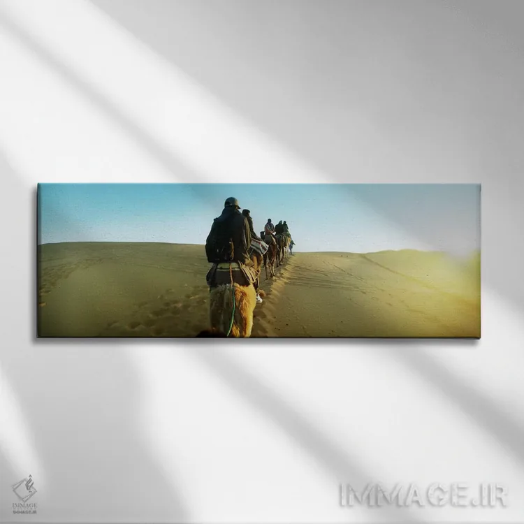 تابلو دکوراتیو Sahara Desert, Morocco,ردیفی از افراد سوار بر شتر در صح… اثر پانورامیک ایمجز - نمای روبهرو روی دیوار
