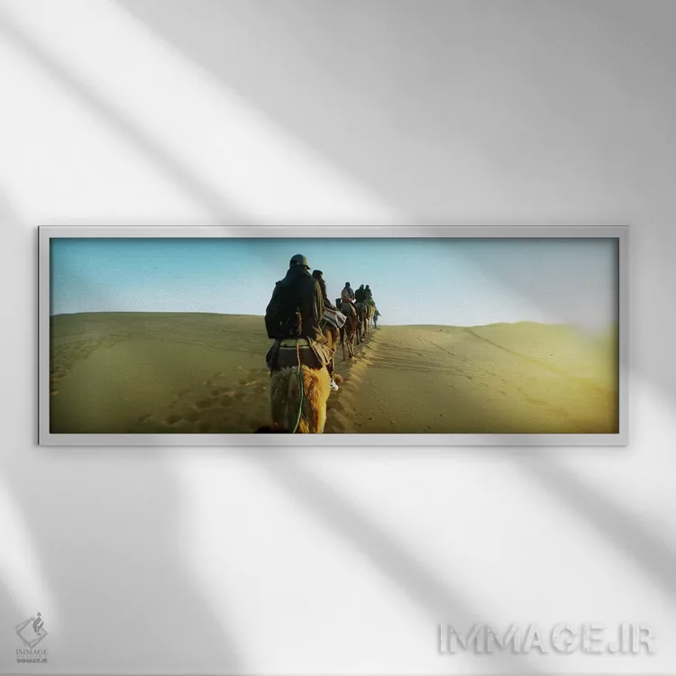 تابلو دکوراتیو Sahara Desert, Morocco,ردیفی از افراد سوار بر شتر در صح… اثر پانورامیک ایمجز - نمای قابدار سفید