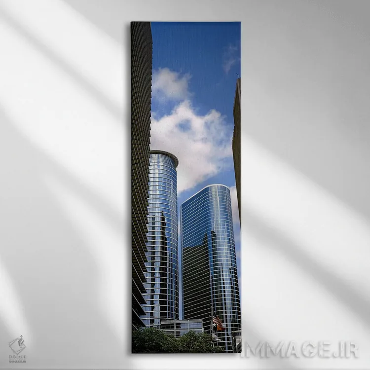 تابلو دکوراتیو نمای پایین از ساختمان ها در یک شهر، برج وج، ساختمان اکس… اثر پانورامیک ایمجز - نمای روبهرو روی دیوار