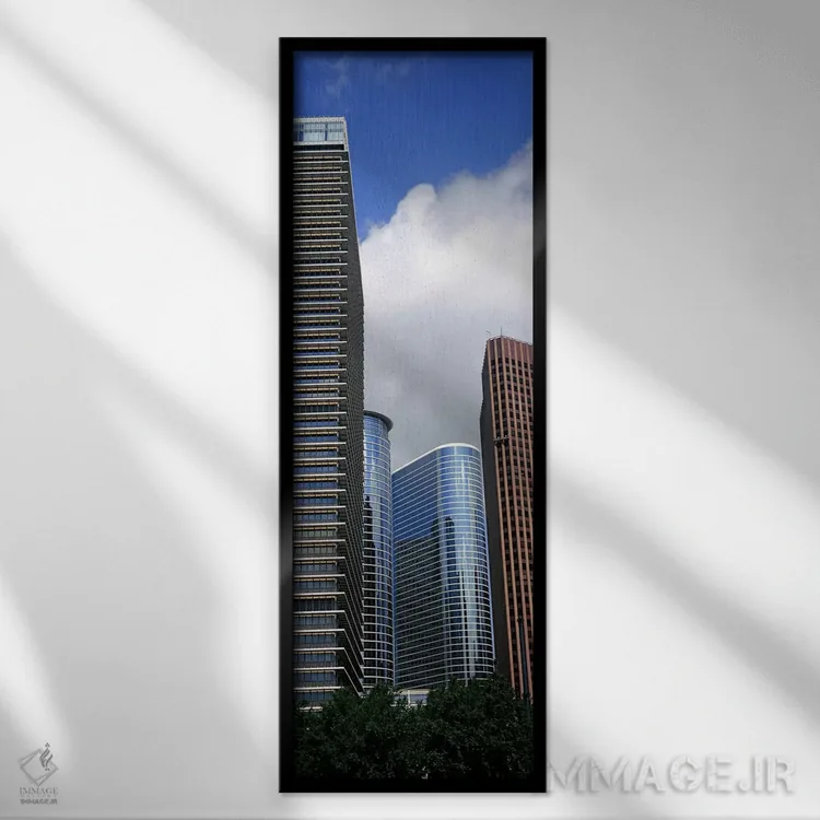 تابلو دکوراتیو نمای پایین از ساختمان ها در یک شهر، برج وج، ساختمان اکس… اثر پانورامیک ایمجز - نمای قابدار مشکی