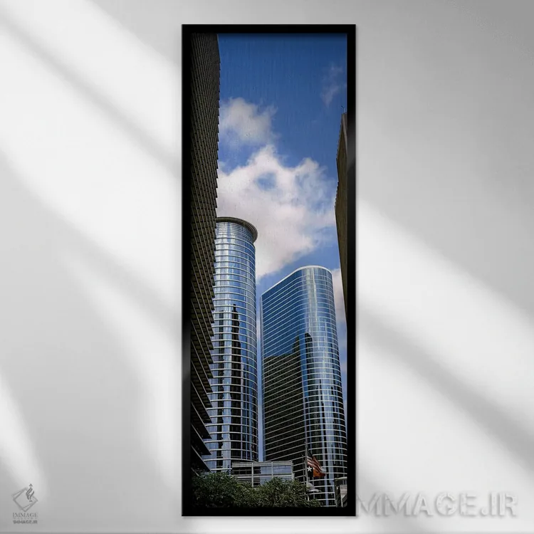 تابلو دکوراتیو نمای پایین از ساختمان ها در یک شهر، برج وج، ساختمان اکس… اثر پانورامیک ایمجز - نمای قابدار مشکی