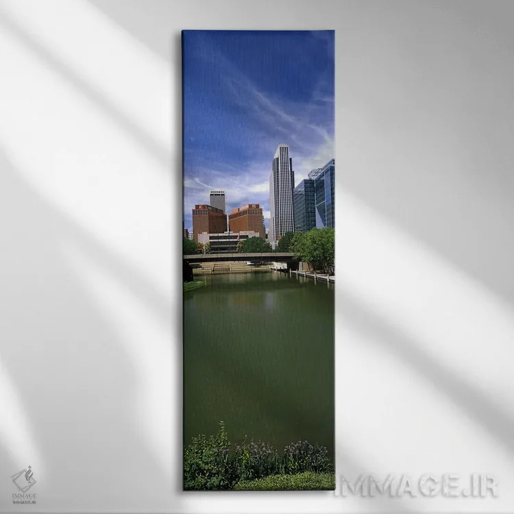 تابلو دکوراتیو ساختمان ها در کنار آب، اوماها، نبراسکا، ایالات متحده آم… اثر پانورامیک ایمجز - نمای روبهرو روی دیوار