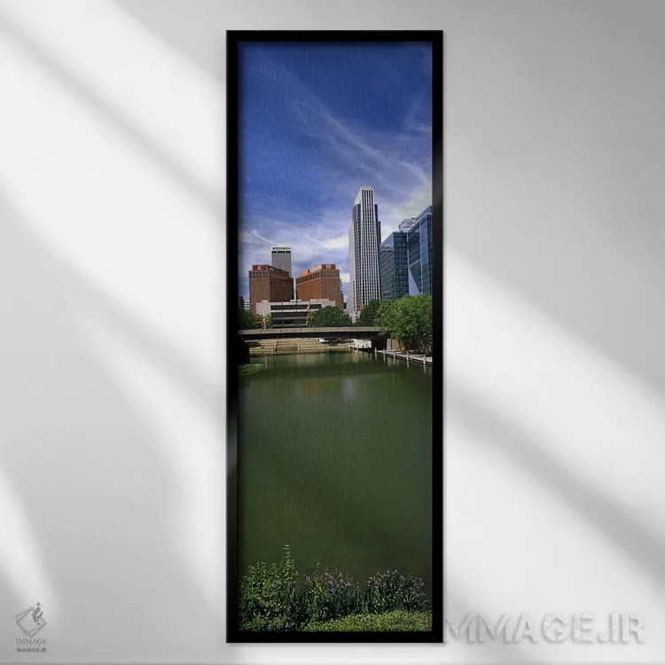تابلو دکوراتیو ساختمان ها در کنار آب، اوماها، نبراسکا، ایالات متحده آم… اثر پانورامیک ایمجز - نمای قابدار مشکی