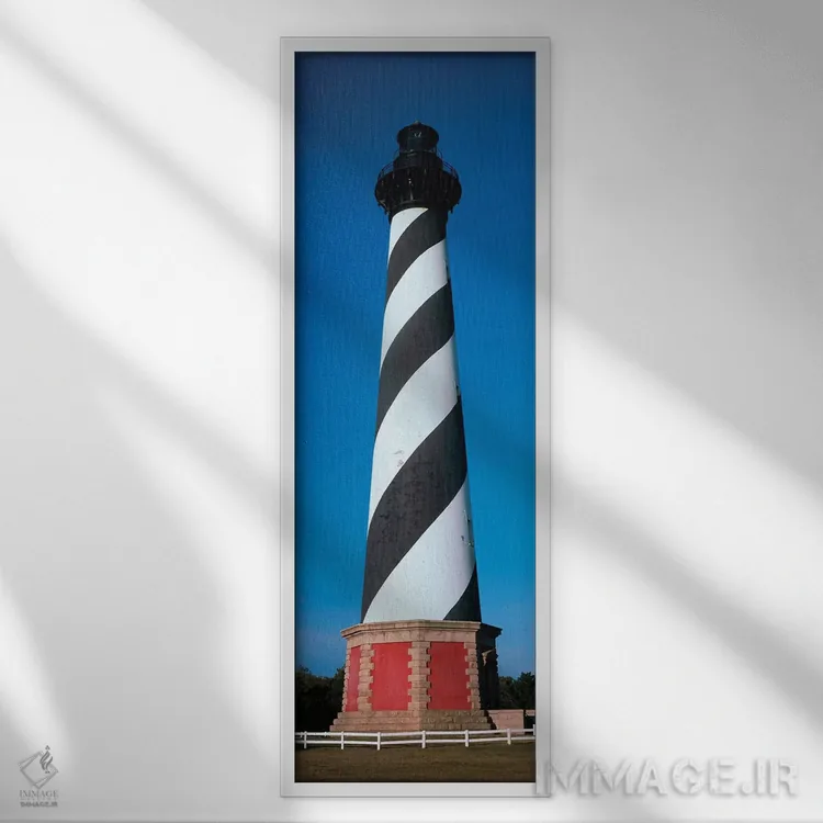 تابلو دکوراتیو "فانوس دریایی کپه هاتراس، جزیره هاتراس، اوتر بنکز، باکس… اثر پانورامیک ایمجز - نمای قابدار سفید