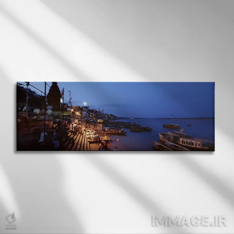 تابلو دکوراتیو Varanasi, Uttar Pradesh, India,غت در کنار رود گنگ در شب… اثر پانورامیک ایمجز - نمای روبهرو روی دیوار