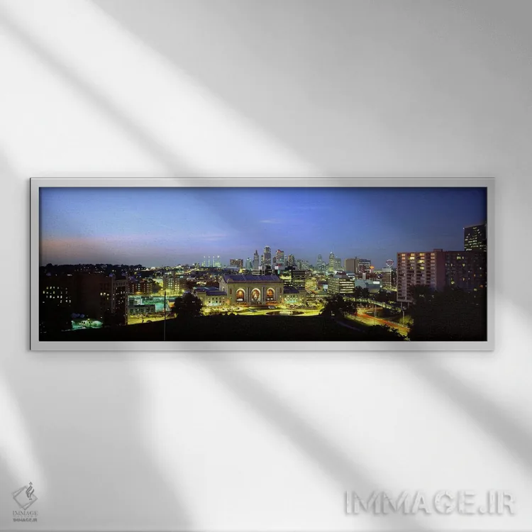 تابلو دکوراتیو Missouri, USA,نمای بالا از شهر روشن شده در غروب، کانزاس… اثر پانورامیک ایمجز - نمای قابدار سفید