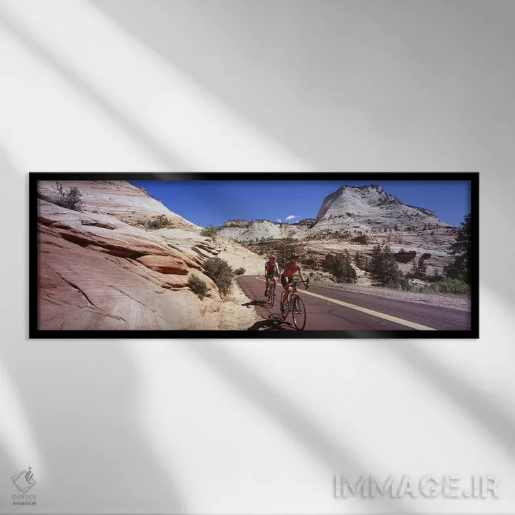تابلو دکوراتیو Zion National Park, Utah, USA,دو نفر در حال دوچرخه سوار… اثر پانورامیک ایمجز - نمای قابدار مشکی
