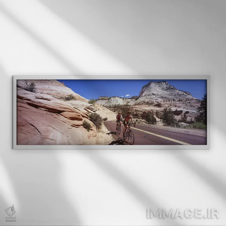 تابلو دکوراتیو Zion National Park, Utah, USA,دو نفر در حال دوچرخه سوار… اثر پانورامیک ایمجز - نمای قابدار سفید