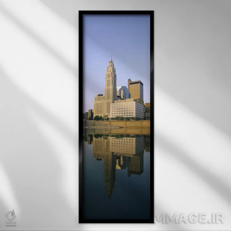 تابلو دکوراتیو Scioto River, Columbus, Ohio, USA,انعکاس ساختمان ها در… اثر پانورامیک ایمجز - نمای قابدار مشکی