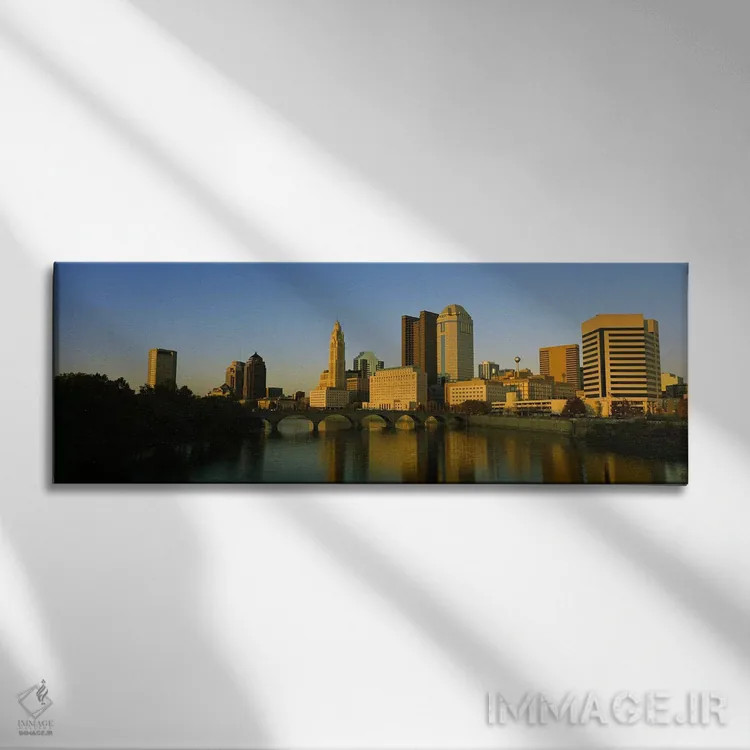 تابلو دکوراتیو Columbus, Ohio, USA,نمای بالا از ساختمان ها در کنار آب… اثر پانورامیک ایمجز - نمای روبهرو روی دیوار