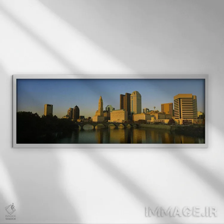 تابلو دکوراتیو Columbus, Ohio, USA,نمای بالا از ساختمان ها در کنار آب… اثر پانورامیک ایمجز - نمای قابدار سفید
