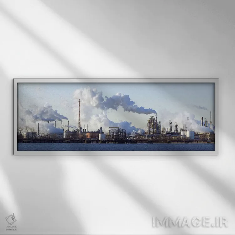 تابلو دکوراتیو دود بلند شده از پالایشگاه نفت کنار رودخانه، رود دلاور… اثر پانورامیک ایمجز - نمای قابدار سفید