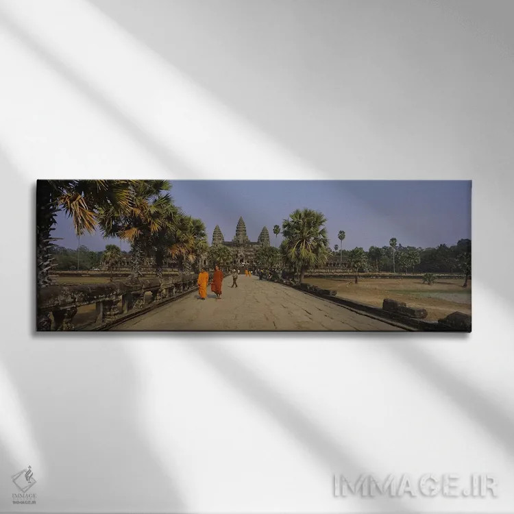 تابلو دکوراتیو Angkor Wat, Siem Reap, Cambodia,دو راهب در حال راه رفتن… اثر پانورامیک ایمجز - نمای روبهرو روی دیوار