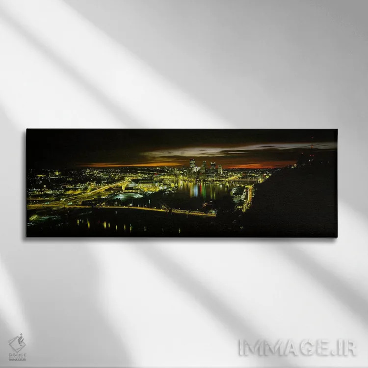 تابلو دکوراتیو Pennsylvania, USA,نمای بالا از ساختمان های روشن شده در… اثر پانورامیک ایمجز - نمای روبهرو روی دیوار