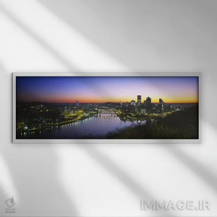 تابلو دکوراتیو Pennsylvania, USA,ساختمان های روشن شده در سپیده دم، پیت… اثر پانورامیک ایمجز - نمای قابدار سفید