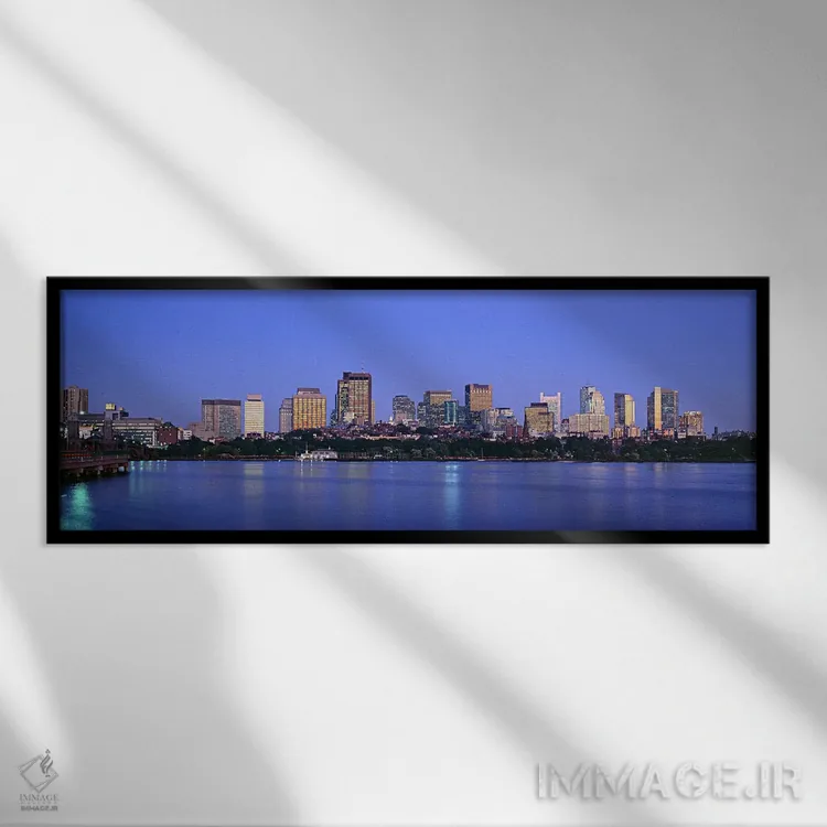 تابلو دکوراتیو Boston, Massachusetts, USA,ساختمان های حاشیه آب روشن در… اثر پانورامیک ایمجز - نمای قابدار مشکی