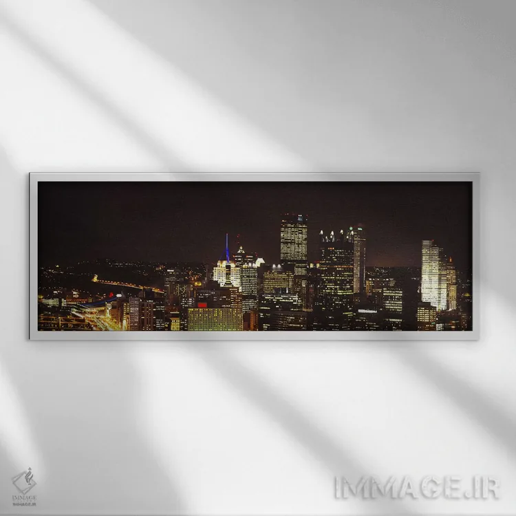 تابلو دکوراتیو USA,ساختمان های روشن در شب در شهر، پیتسبورگ، پنسیلوانیا… اثر پانورامیک ایمجز - نمای قابدار سفید