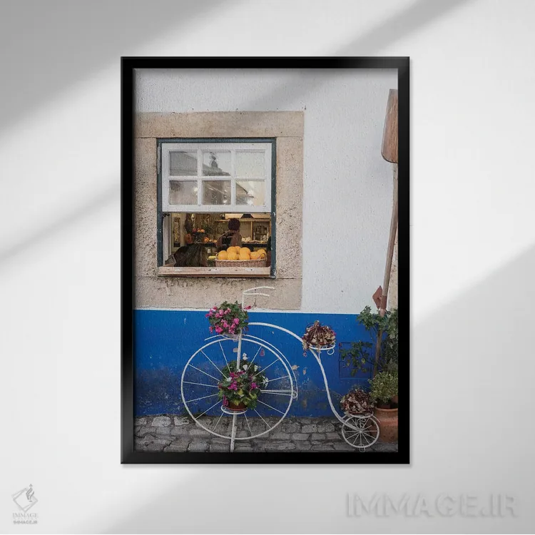 تابلو دکوراتیو Obidos, Portugal,گلدان دوچرخه ای بامزه مقابل یک نانوایی در شه… اثر جولی اگرز - نمای قابدار مشکی