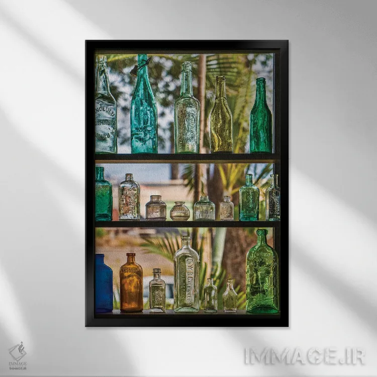 تابلو دکوراتیو مجموعه بطری ها اثر جنت فیکار - نمای قابدار مشکی